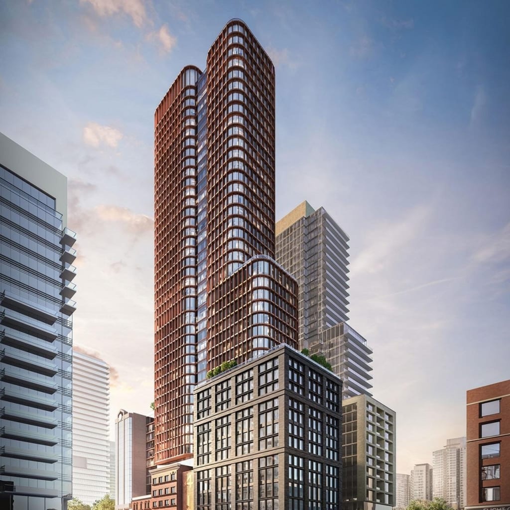 Four Eleven King Condos exterior with surrounding cityscape at dusk.