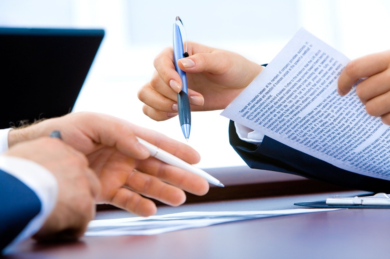 Woman and man going through legal real estate documents together.