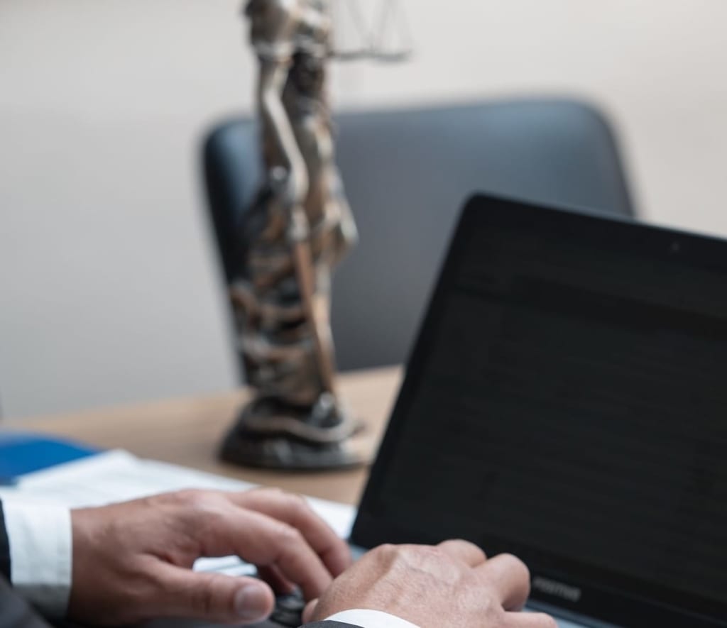 Lawyer working on a laptop.