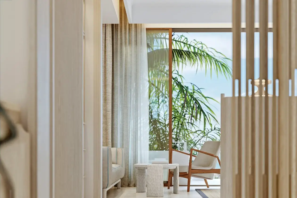 Cozy seating corner with a serene ocean view from a luxury room in Vie L'Ven, St. Maarten.