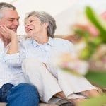 Loving senior couple on sofa