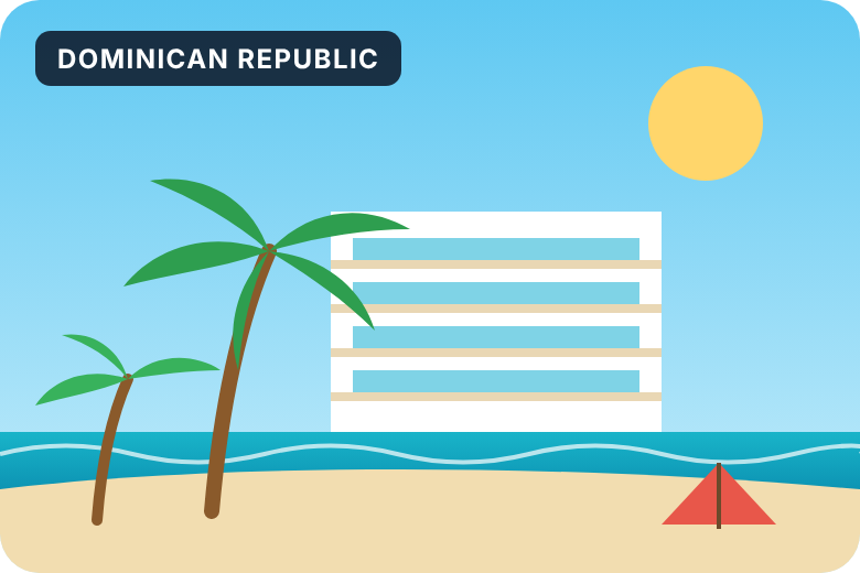 Dominican Republic: a resort building beside a palm tree and the sea