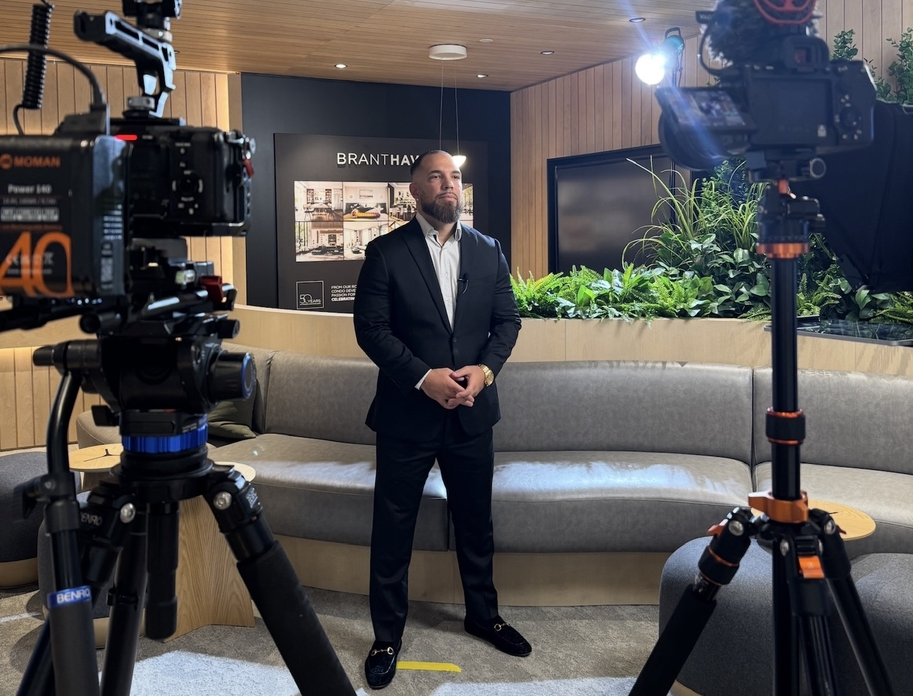 Daniel Zareh filming at a presentation centre