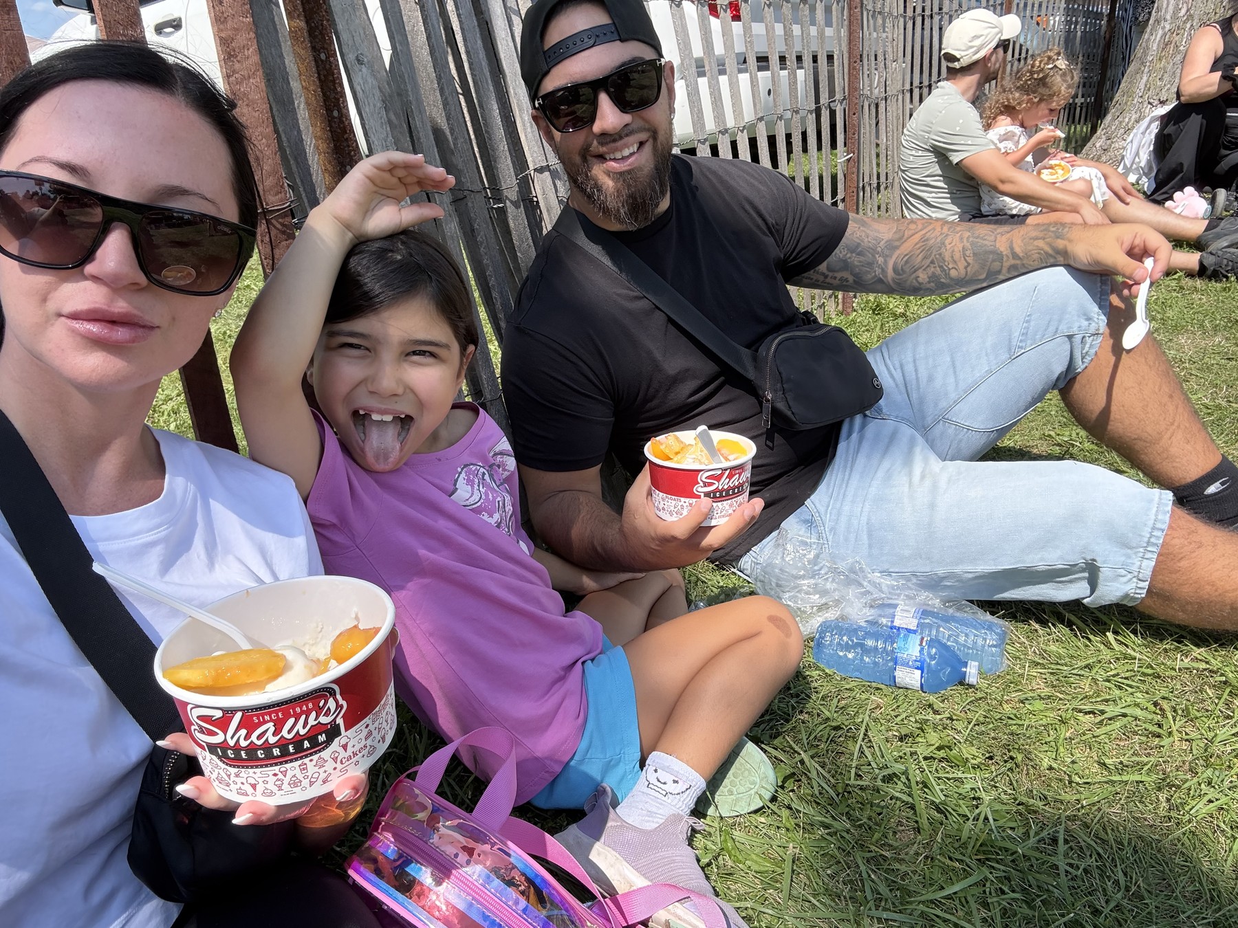 Daniel Zareh and his family with peach sundaes at the Winona Peach Festival